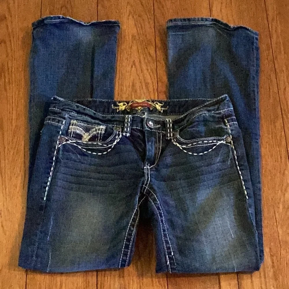 Maurices Distressed denim Blue Boot Cut Jeans. Women’s size 7/8 R